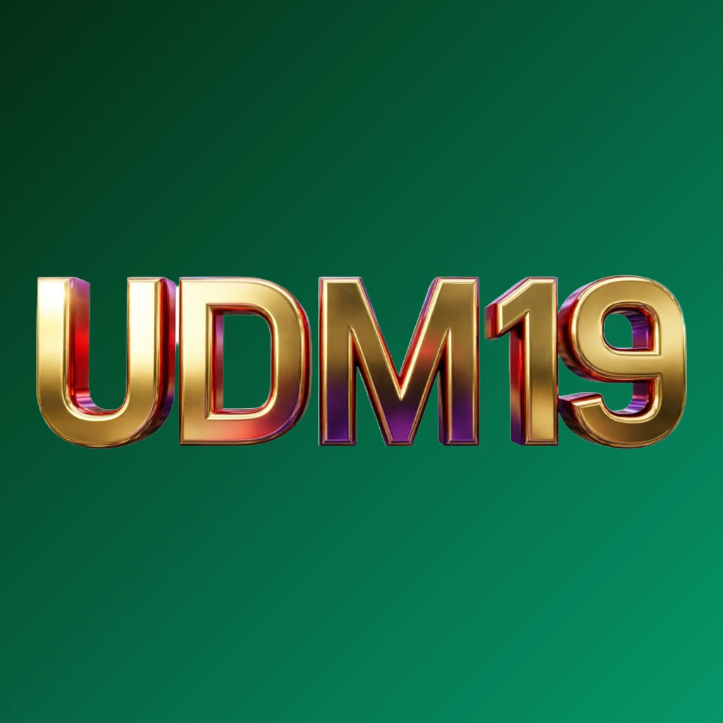 Bright premium UDM 19 logo with thick uppercase typography in vivid gold, red, and purple colors, featuring a polished metallic finish and strong visual impact on a transparent background, designed as a wide horizontal rectangular wordmark for website header